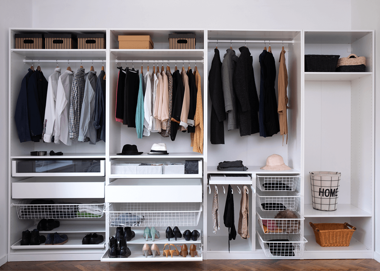 Organized closet with clothes and accessories displayed.