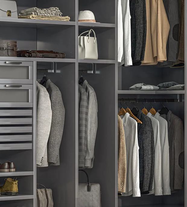 Open wardrobe with hanging clothes and accessories.